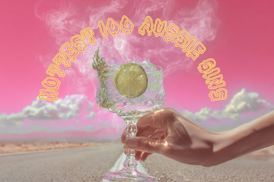 Hand holding a glass of steaming gin with teh text Hottest 100 Aussie Gins curved above. 